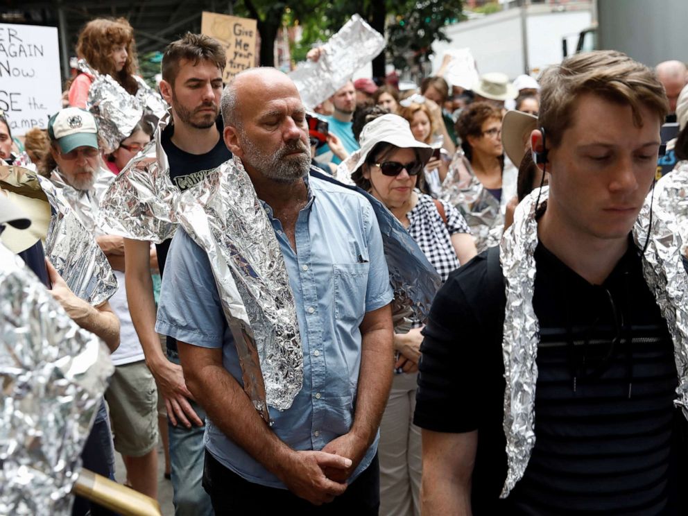 PHOTO: Demonstrators take a moment of silence in a Close the Camps rally to demand the closure of inhumane immigrant detention centers outside the Middle Collegiate Church in New York, July 2, 2019.