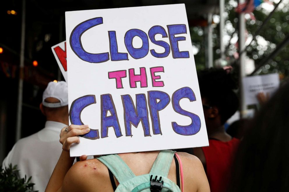 PHOTO: A demonstrator holds a sign during a 'Close the Camps' rally to demand the closure of inhumane immigrant detention centers outside the Middle Collegiate Church in New York, July 2, 2019.