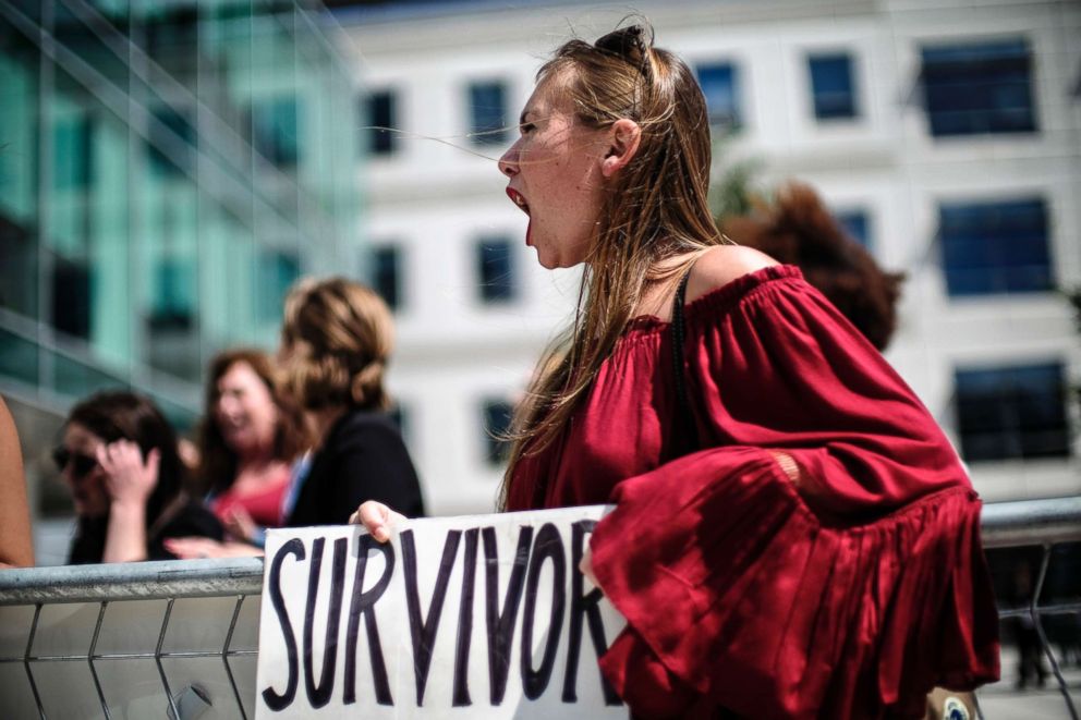 PHOTO: Meghan Downey of Chatham, N.J., protests as Education Secretary Betsy DeVos announces changes in federal policy on rules for investigating sexual assault reports on college campuses in Arlington, Va., Sept. 7, 2017.