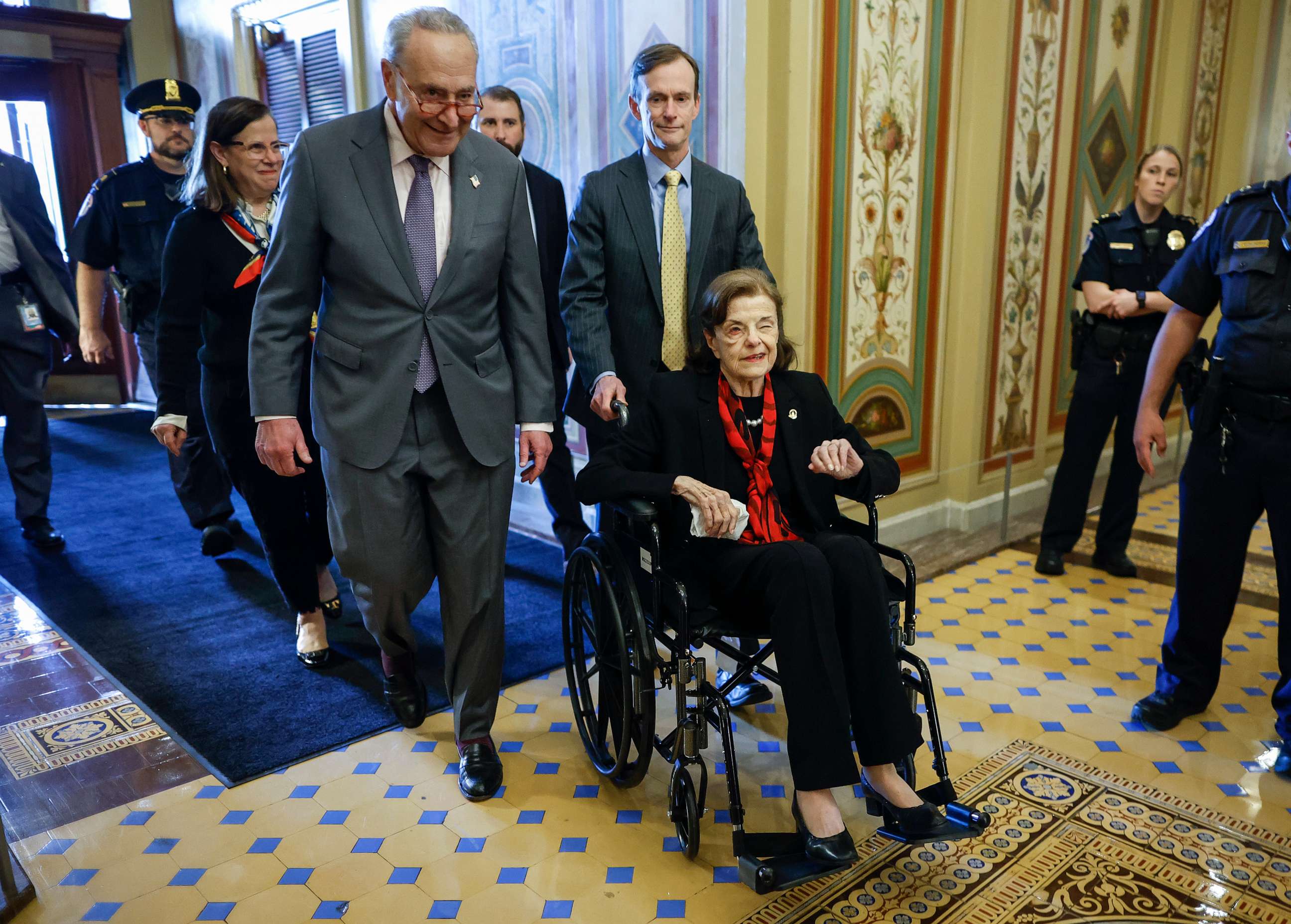 PHOTO: Senate Majority Leader Charles Schumer escorts Sen. Dianne Feinstein as she arrives at the U.S. Capitol following a long absence due to health issues May 10, 2023, in Washington.