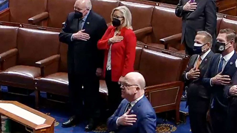 PHOTO: Former Vice President Dick Cheney and Rep. Liz Cheney recite the pledge of allegiance on the floor of the U.S. House of Representatives in Washington, on Jan. 6, 2021.