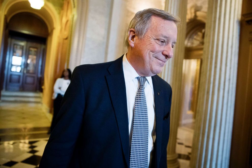 PHOTO: Sen. Dick Durbin (D-Ill), the Senate Democratic whip, smiles as he heads for a weekly policy luncheon on Capitol Hill, Dec. 12, 2017.