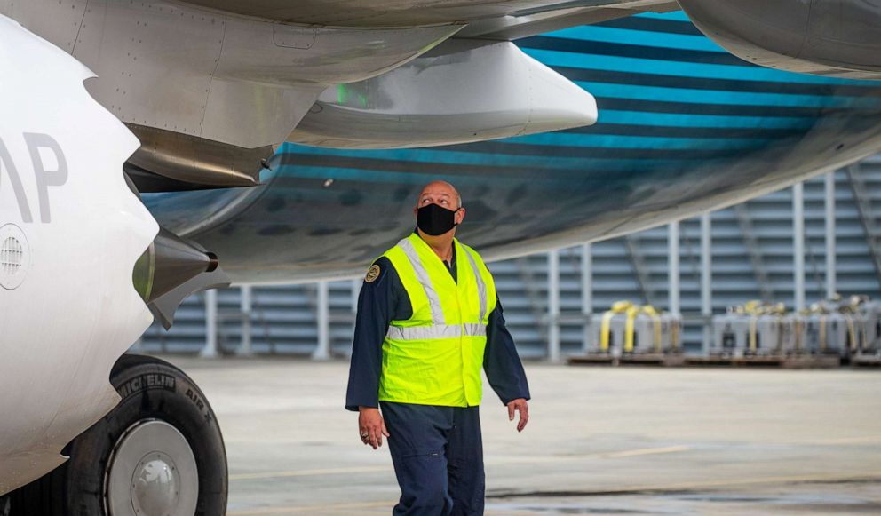 PHOTO: FAA chief Steve Dickson walks around a Boeing 737 MAX, conducting a pre-flight check ahead of take-off from Boeing Field on Sept. 30, 2020, in Seattle.