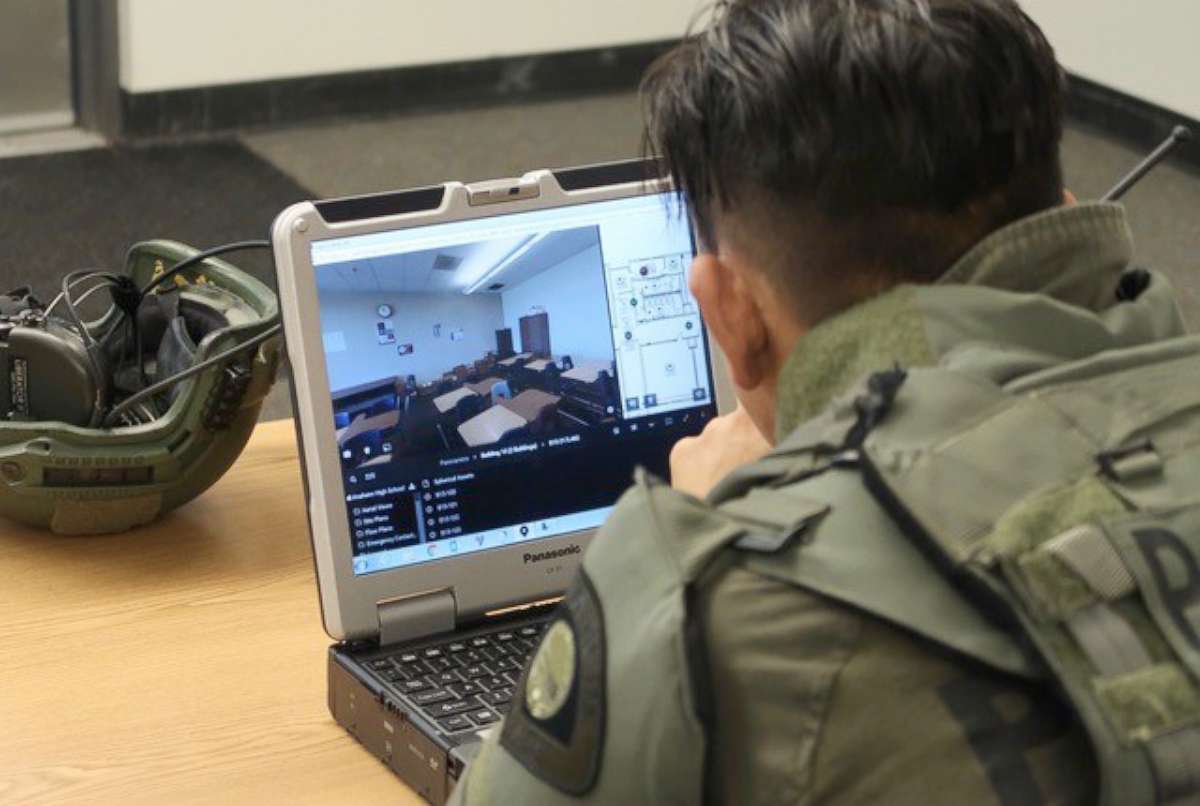 PHOTO: A tactical officer studies a digital-map of Anaheim High School on July 19, 2018, during a training exercise.