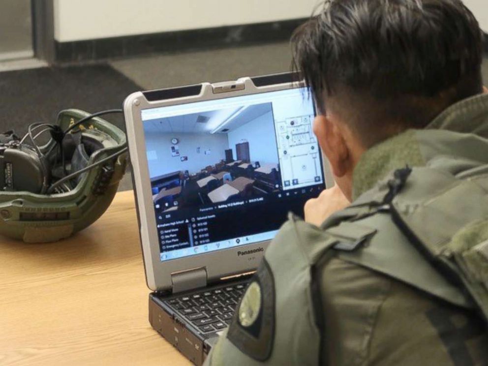PHOTO: A tactical officer studies a digital-map of Anaheim High School on July 19, 2018, during a training exercise.