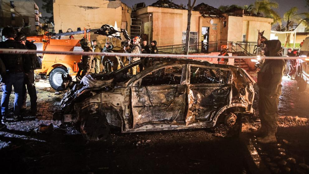 PHOTO: Emergency response personnel work at the site of damage after Iranian missile barrages struck Dimona, amid the U.S.-Israel conflict with Iran, in southern Israel, March 21, 2026.
