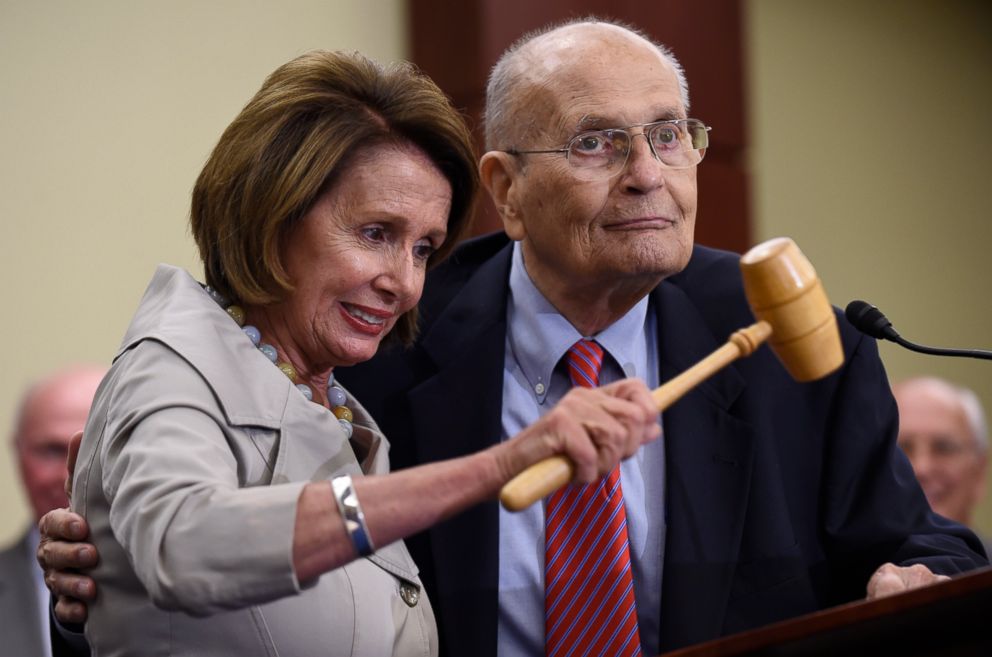 PHOTO: In this July 29, 2015 file photo, House Minority Leader Nancy Pelosi of Calif., standing with former Rep. John Dingell, D-Mich., holds up the gavel Dingell used 50 years ago when Medicare legislation was passed.