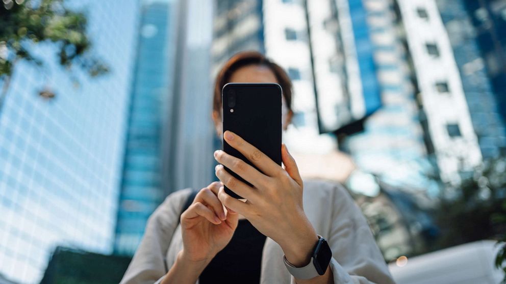 PHOTO: Stock photo of woman using her mobile phone.