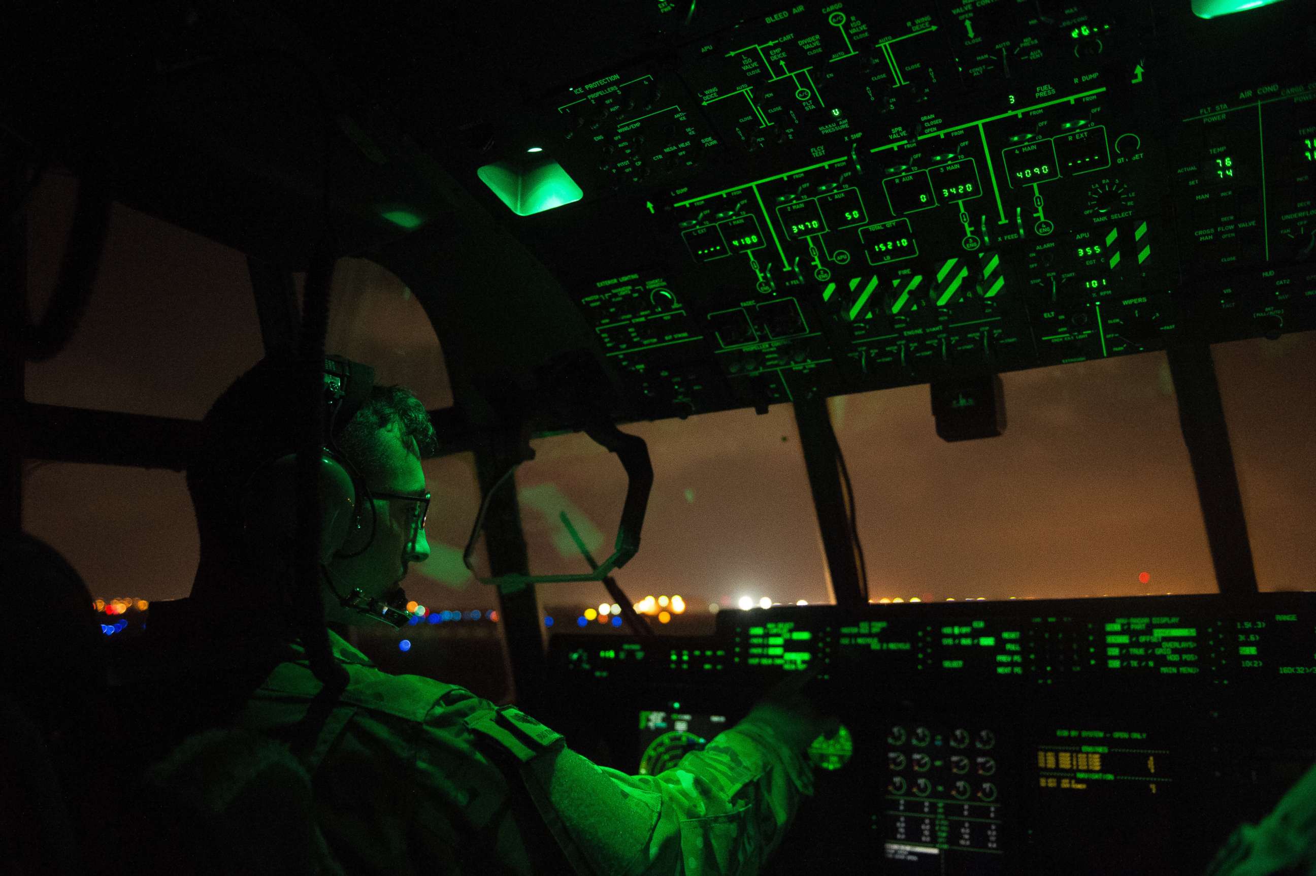 PHOTO: A U.S. Air Force pilot assigned to the 75th Expeditionary Airlift Squadron, 449th Air Expeditionary Group conducts post-flight procedures on board a C-130J Super Hercules at Camp Lemonnier, Djibouti, April 5, 2016.