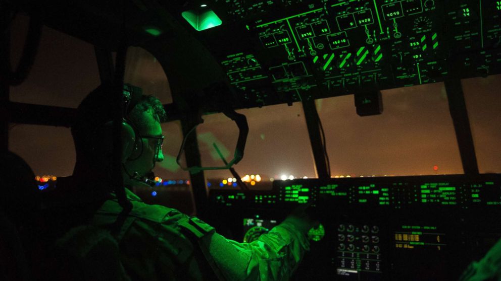 PHOTO: A U.S. Air Force pilot assigned to the 75th Expeditionary Airlift Squadron, 449th Air Expeditionary Group conducts post-flight procedures on board a C-130J Super Hercules at Camp Lemonnier, Djibouti, April 5, 2016.