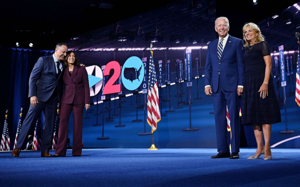 PHOTO: Democratic vice presidential nominee Sen. Kamala Harris and her husband Douglas Emhoff stand on stage with Democratic presidential candidate Joe Biden and his wife Dr. Jill Biden during the Democratic National Convention, Aug. 19, 2020.