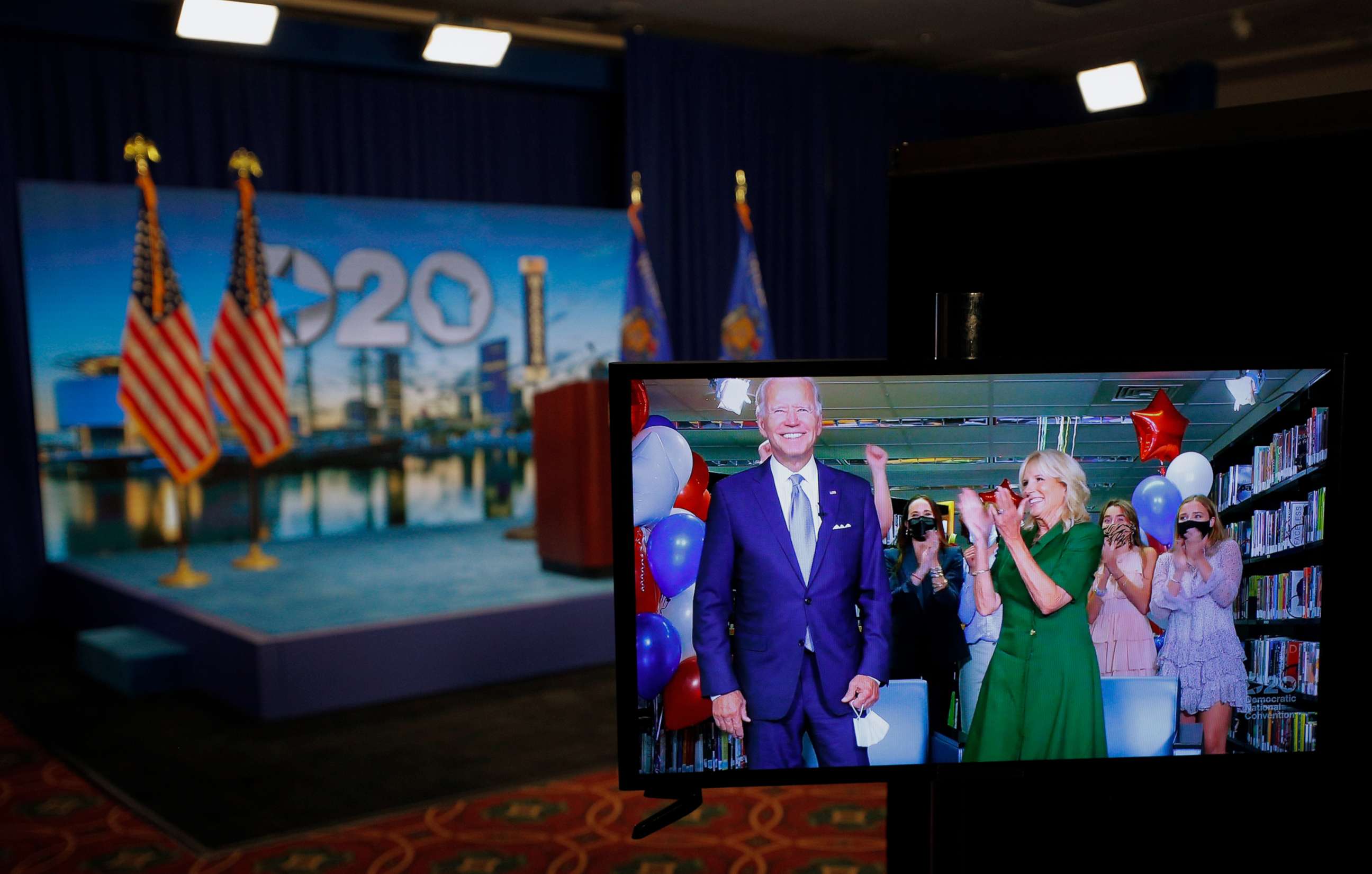 PHOTO: Democratic presidential nominee former Vice President Joe Biden celebrates via video feed from Delaware with his wife Dr. Jill Biden and his grandchildren after following roll call on the second night of the 2020 Democratic National Convention.