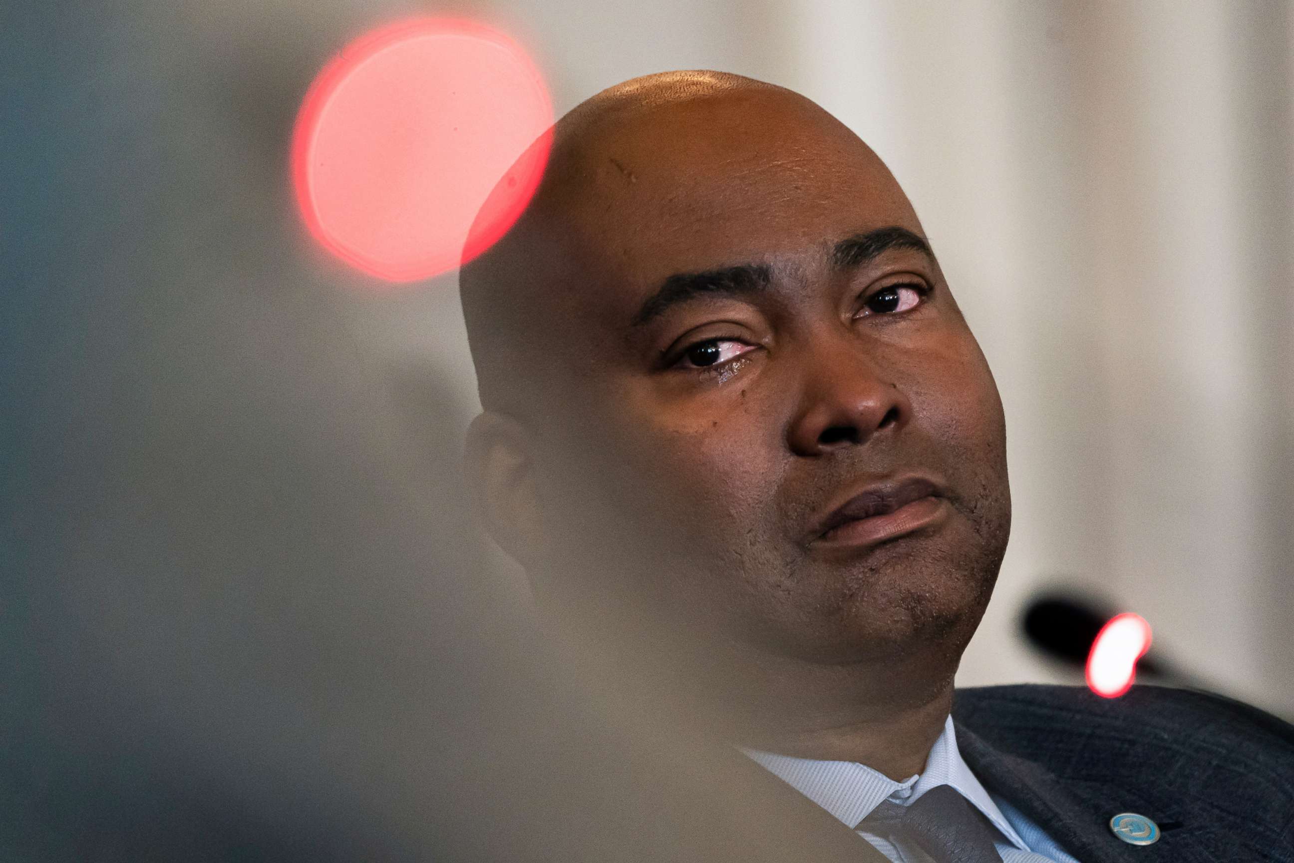 PHOTO: Democratic National Committee chair Jaime Harrison cries listening to committee member Donna Brazile talk about the importance of proposed changes to the primary system during a DNC Rules and Bylaws Committee meeting on Dec. 2, 2022, in Washington.