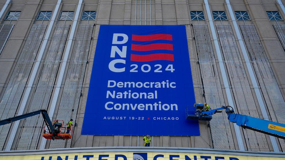 PHOTO: Signage is hung on the exterior of the United Center in preparation for next week's Democratic National Convention in Chicago, Aug. 14, 2024.