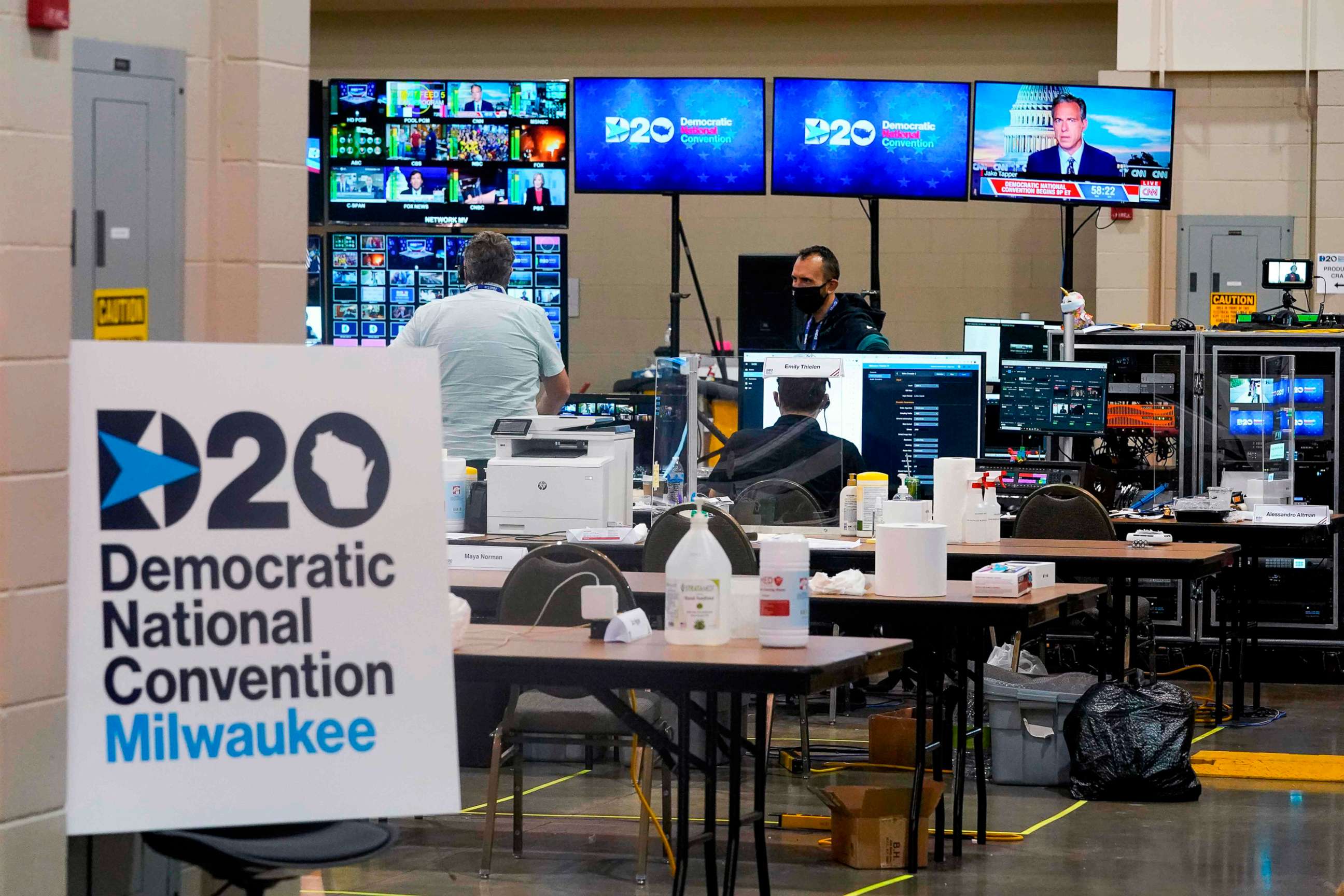 PHOTO: People work in the control room for the Democratic National Convention before the start of the convention at the Wisconsin Center in Milwaukee, Aug. 17, 2020.