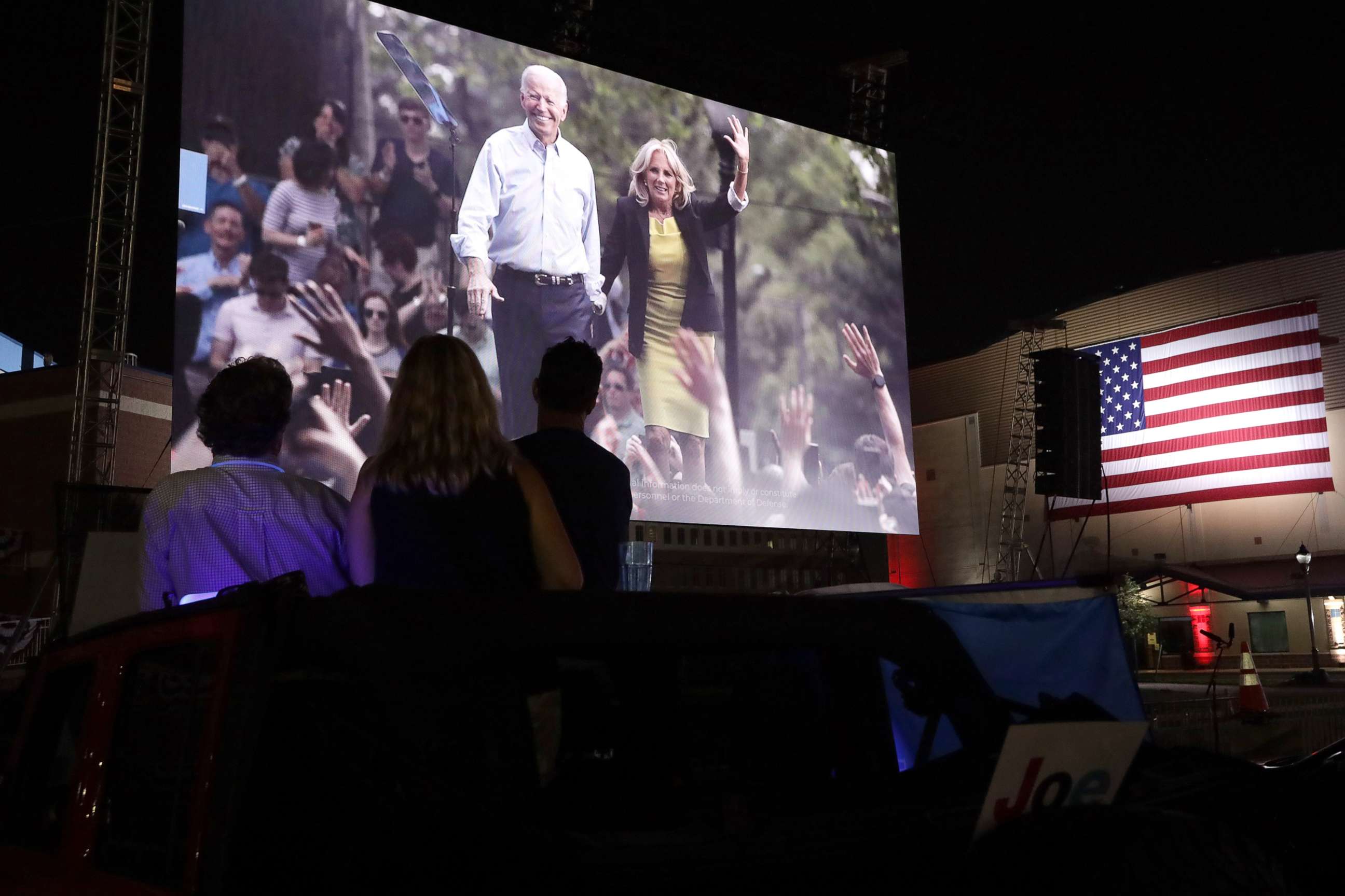 PHOTO: People listen to the Democratic National Convention being broadcast in a parking lot outside Chase Center in Wilmington, Del., Aug. 20, 2020.