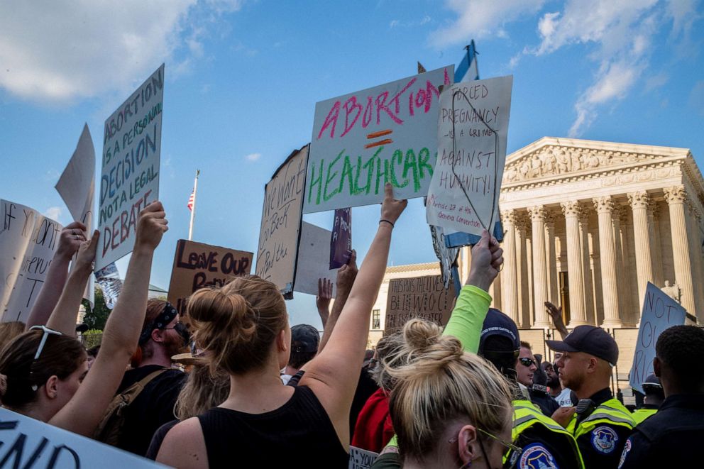 PHOTO: Abortion-rights demonstrators protest in front of the Supreme Court building following the announcement of the Dobbs v Jackson Women's Health Organization ruling, June 25, 2022.