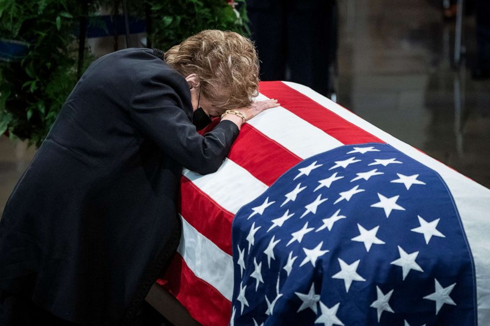 PHOTO: Former Sen. Elizabeth Dole rests her head on the casket of her husband and former Sen. Bob Dole in the Rotunda of the Capitol building, where lays in state, Dec. 9, 2021, in Washington, D.C.
