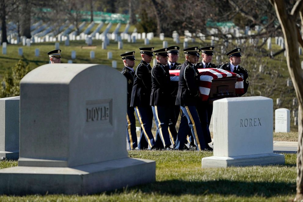 PHOTO: A military honor guard carries the casket containing the remains of Bob Dole, during burial services at Arlington National Cemetery in Arlington, Va., Feb. 2, 2022.