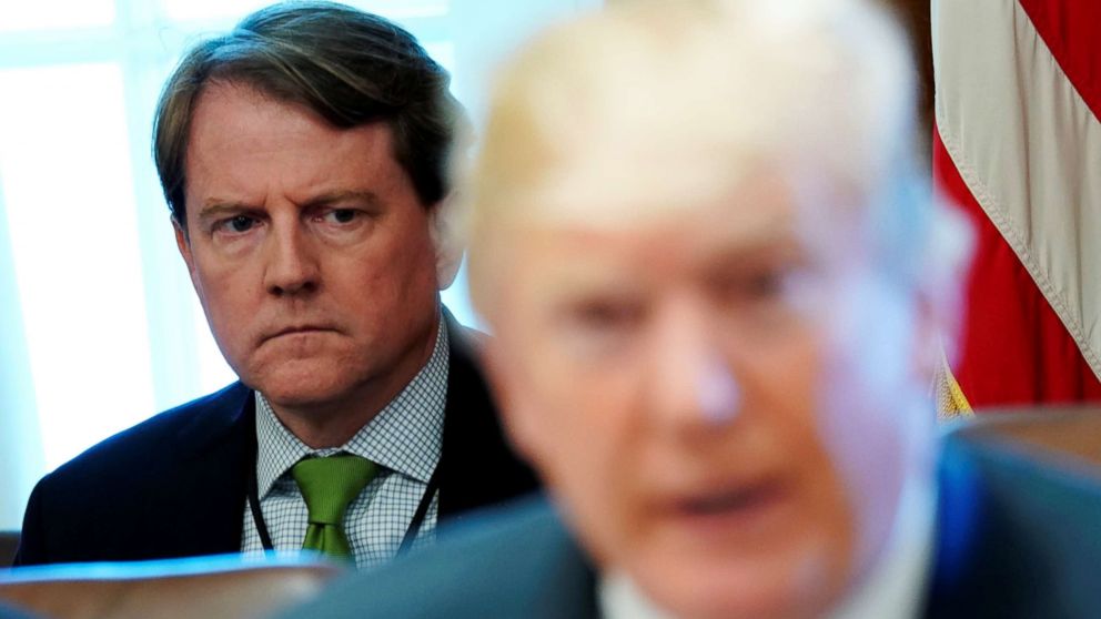 PHOTO: White House Counsel Don McGahn sits behind President Donald Trump as the president holds a cabinet meeting at the White House in Washington, D.C., June 21, 2018.