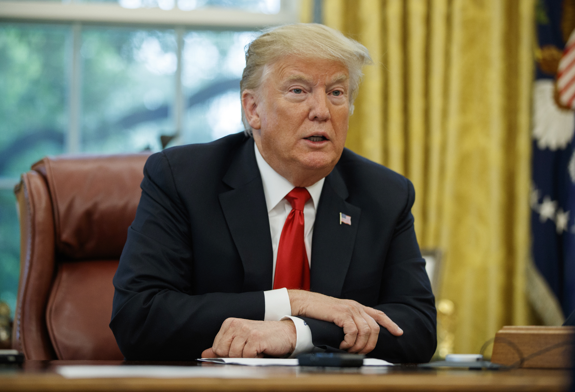 PHOTO: President Donald Trump speaks during an interview with The Associated Press in the Oval Office of the White House, Oct. 16, 2018, in Washington.