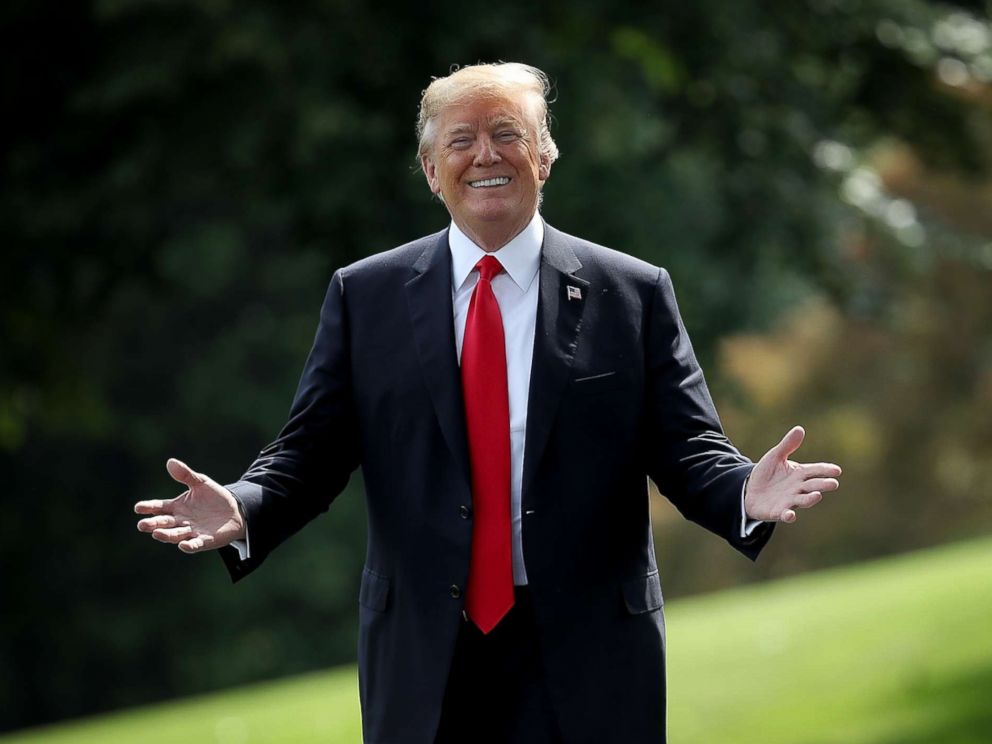 PHOTO: U.S. President Donald Trump gestures toward journalists shouting questions as he departs the White House, May 29, 2018, in Washington.