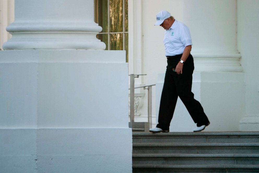 PHOTO: President Donald Trump walks from the White House to his motorcade before traveling to his Virginia golf club on Oct. 21, 2017 in Washington.