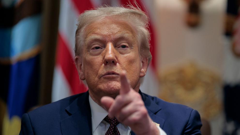 PHOTO: Donald Trump calls on a reporter during a cabinet meeting with members of his administration in the Cabinet Room of the White House on August 26, 2025 in Washington, DC.