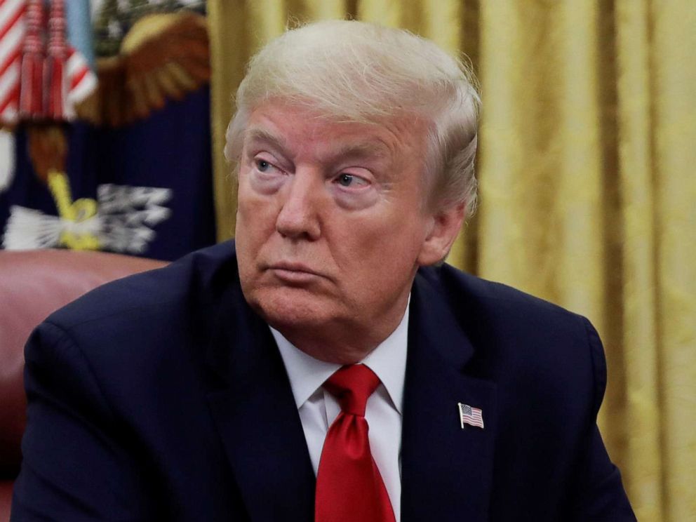 PHOTO: President Donald Trump listens during an event with Gilead Sciences on their work on HIV and Hepatitis C, in the Oval Office at the White House in Washington, May 1, 2020.