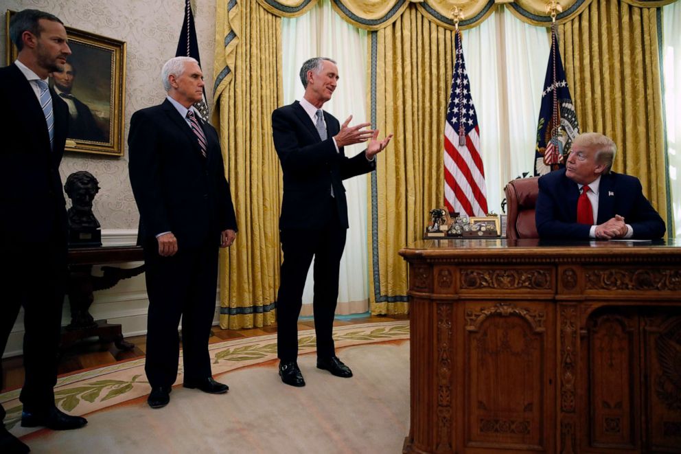 PHOTO: Daniel O'Day, CEO of Gillead Sciences Inc., speaks during a meeting with President Donald Trump in the Oval Office of the White House, May 1, 2020, in Washington, as Vice President Mike Pence and Adam Boehler watch.