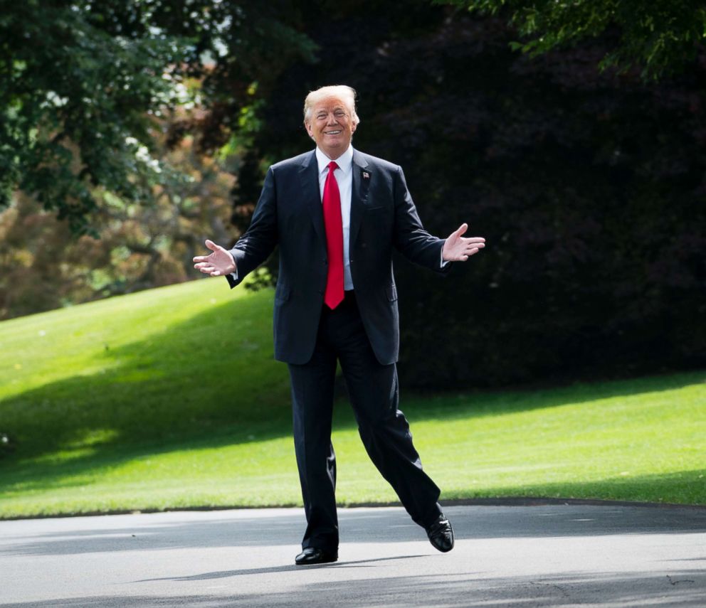 PHOTO: President Donald Trump gestures towards reporters as he walks out of the Oval Office at the White House, May 29, 2018.