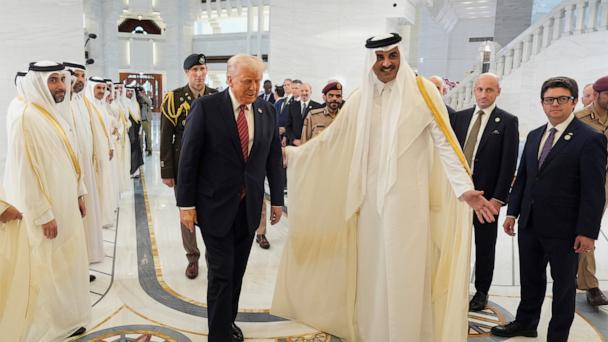 Qatar's Emir Sheikh Tamim bin Hamad Al Thani welcomes President Donald Trump during an official welcoming ceremony at the Amiri Diwan in Doha, Qatar, May 14, 2025.