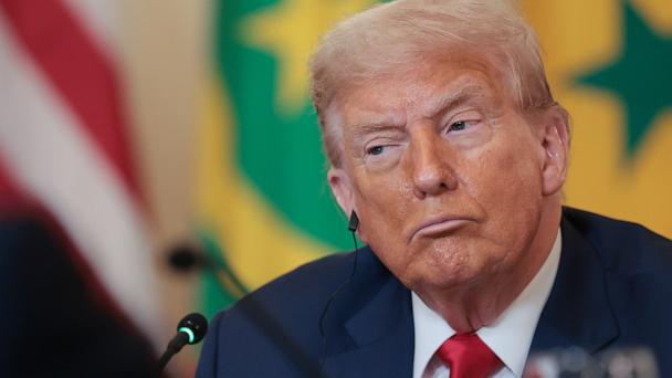 Donald Trump listens as African Leaders deliver remarks during a multilateral lunch in the State Dining Room of the White House July 9, 2025 in Washington, DC.