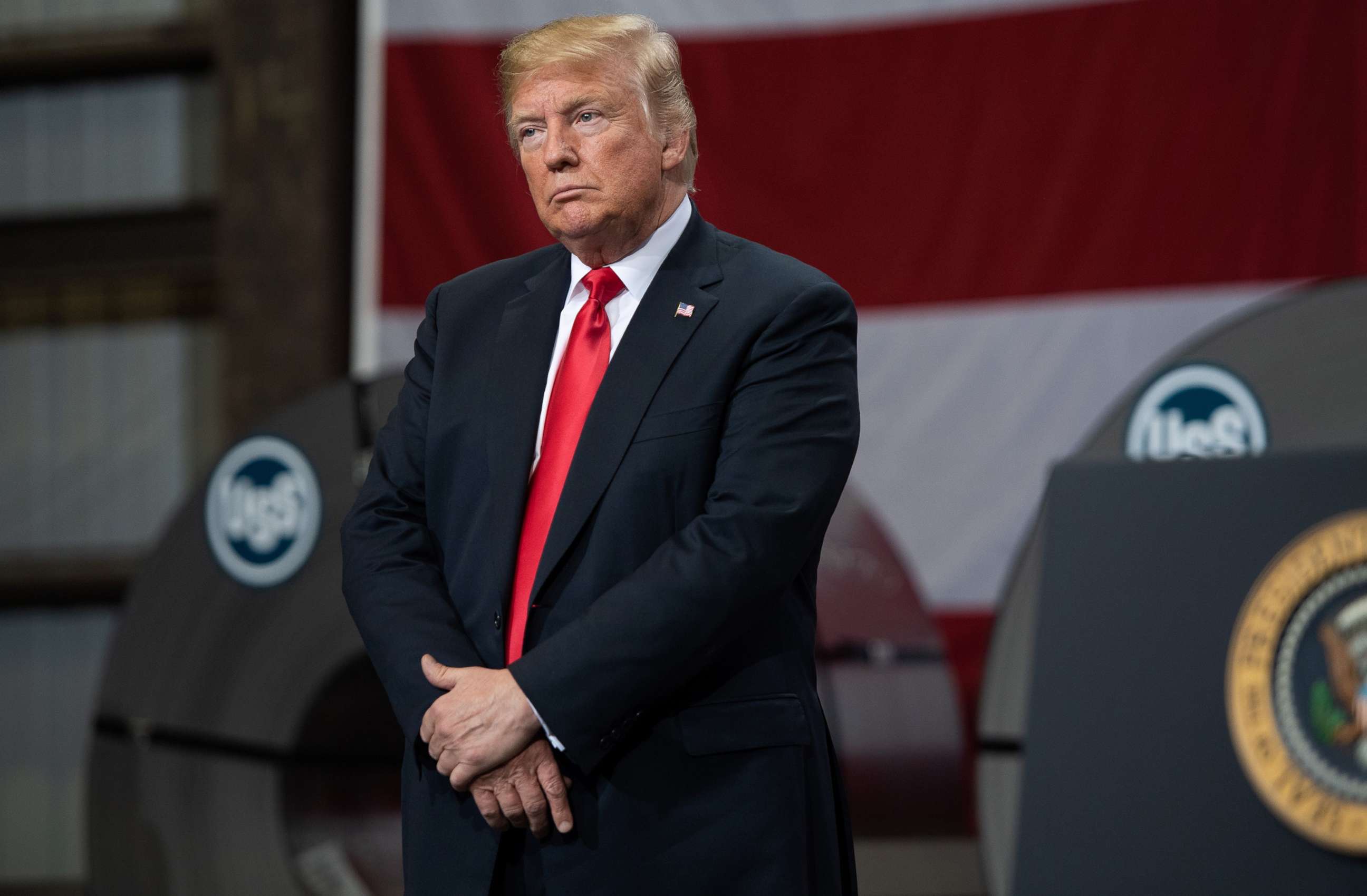 PHOTO: President Donald Trump stands on stage during a speech about trade at U.S. Steel's Granite City Works steel mill in Granite City, Ill., July 26, 2018.