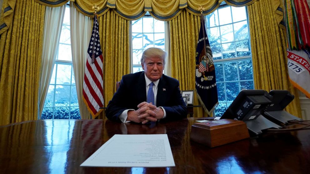 PHOTO: President Donald Trump sits at the Resolute desk during an interview with Reuters at the White House in Washington, D.C., Jan. 17, 2018.