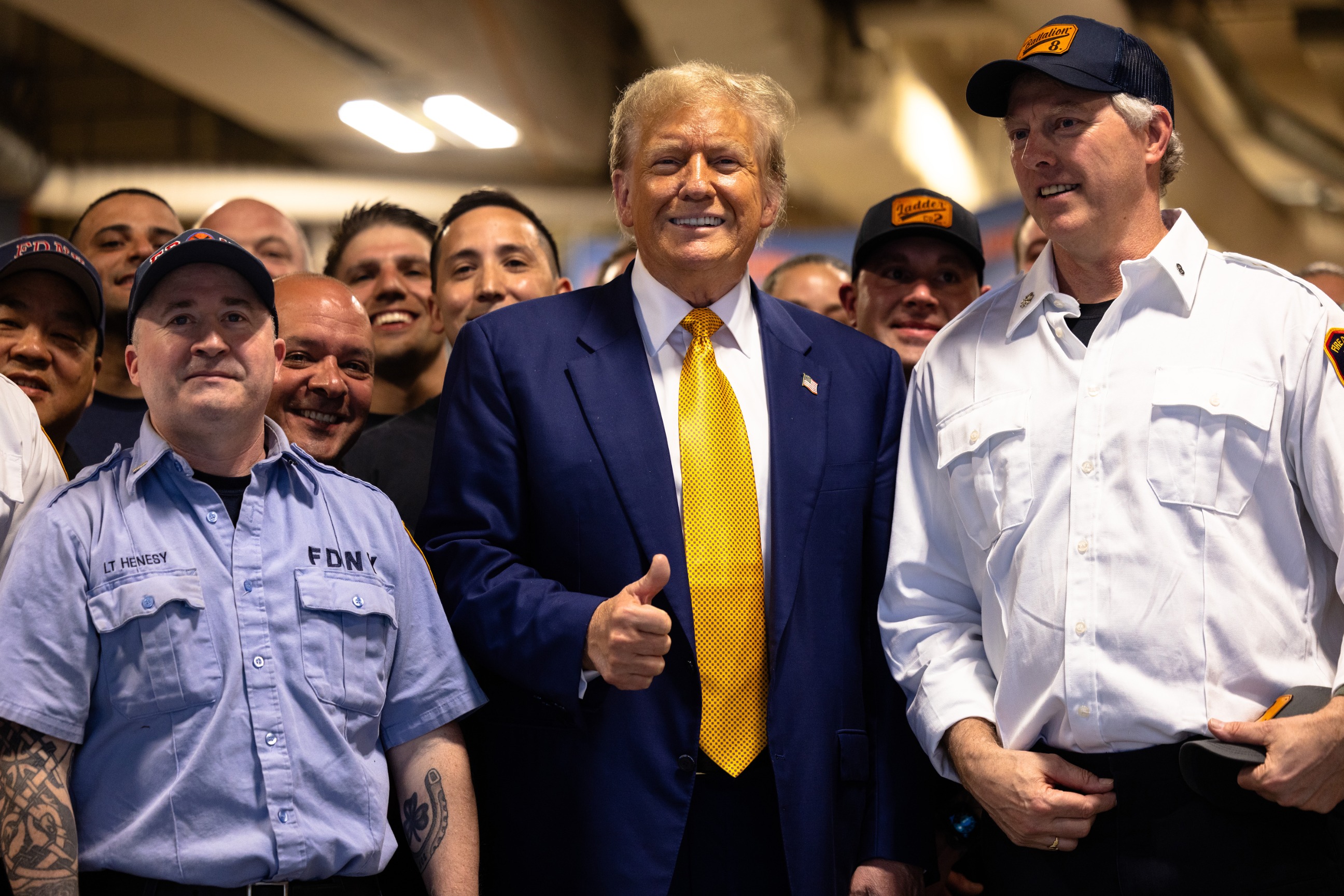 PHOTO: Republican presidential candidate and former U.S. President Donald Trump poses for photos with members of the FDNY Engine 2, Battalion 8 firehouse, May 2, 2024, in New York.