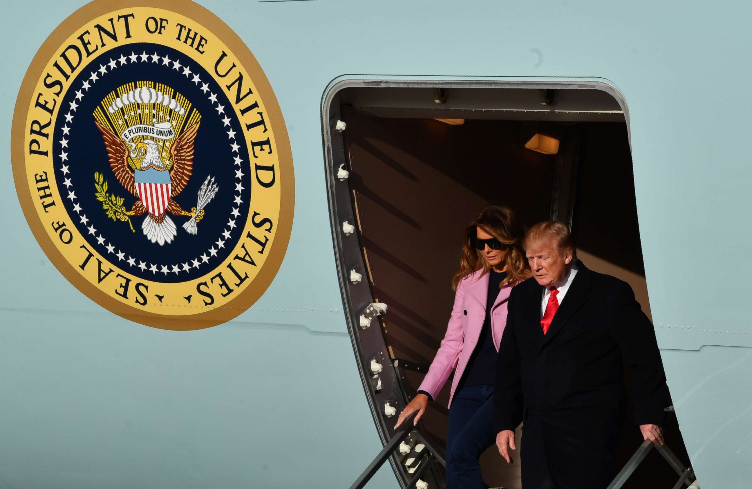 PHOTO: President Donald Trump and first lady Melania Trump step off Air Force One upon arrival at Andrews Air Force Base in Maryland.