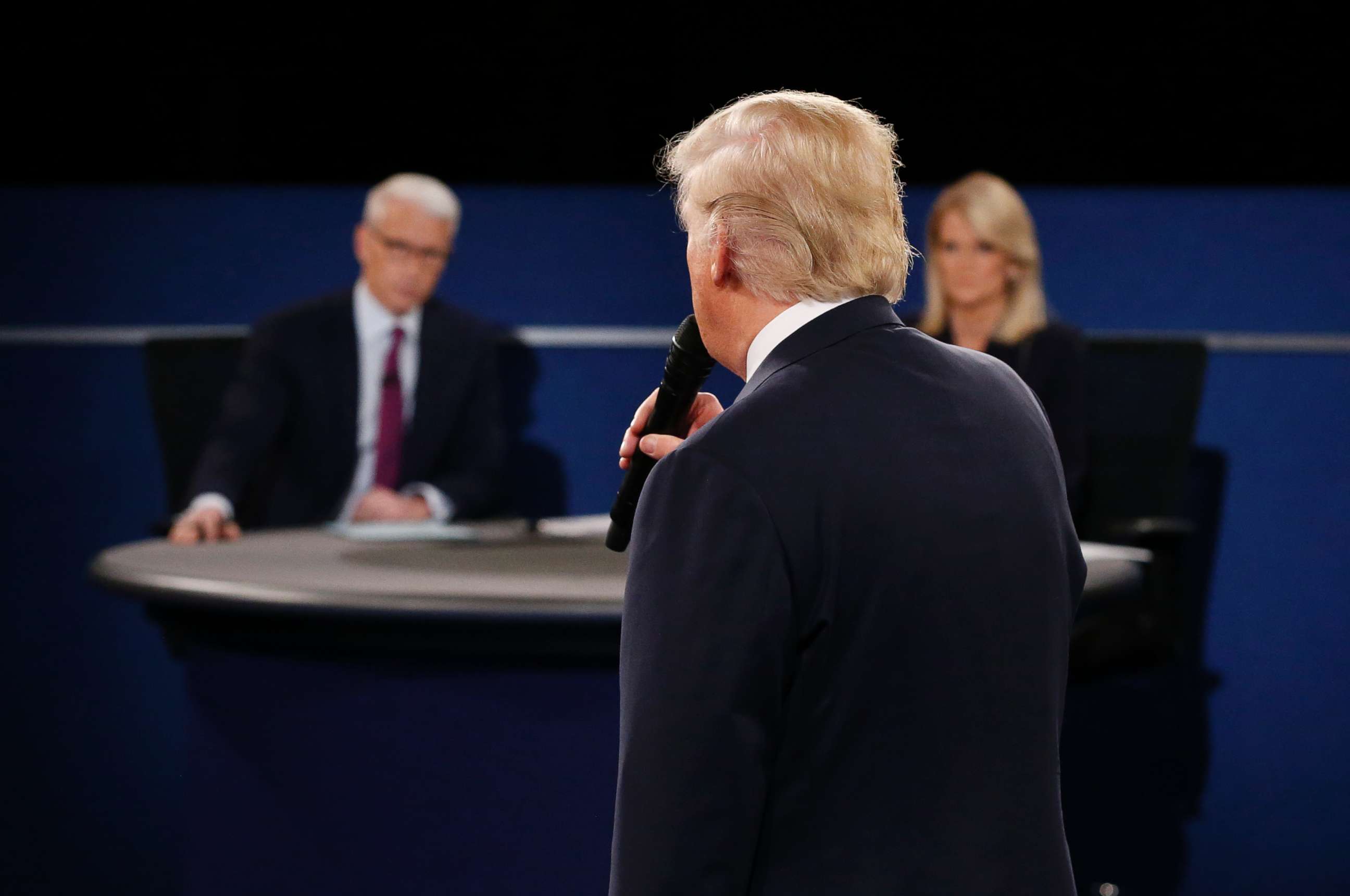 PHOTO: Moderators Anderson Cooper and Martha Raddatz listen as Republican presidential nominee Donald Trump speaks during the second debate at Washington University in St. Louis, Missouri on Oct. 9, 2016.