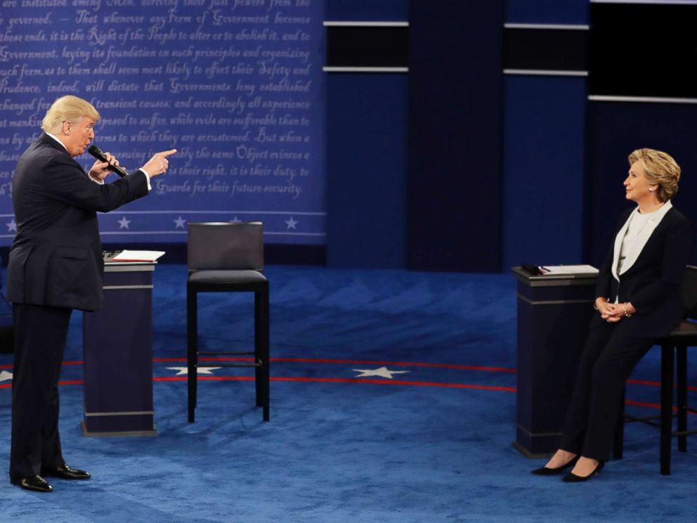 PHOTO: Republican presidential nominee Donald Trump speaks to Democratic presidential nominee Hillary Clinton during the second presidential debate in St. Louis, Oct. 9, 2016.
