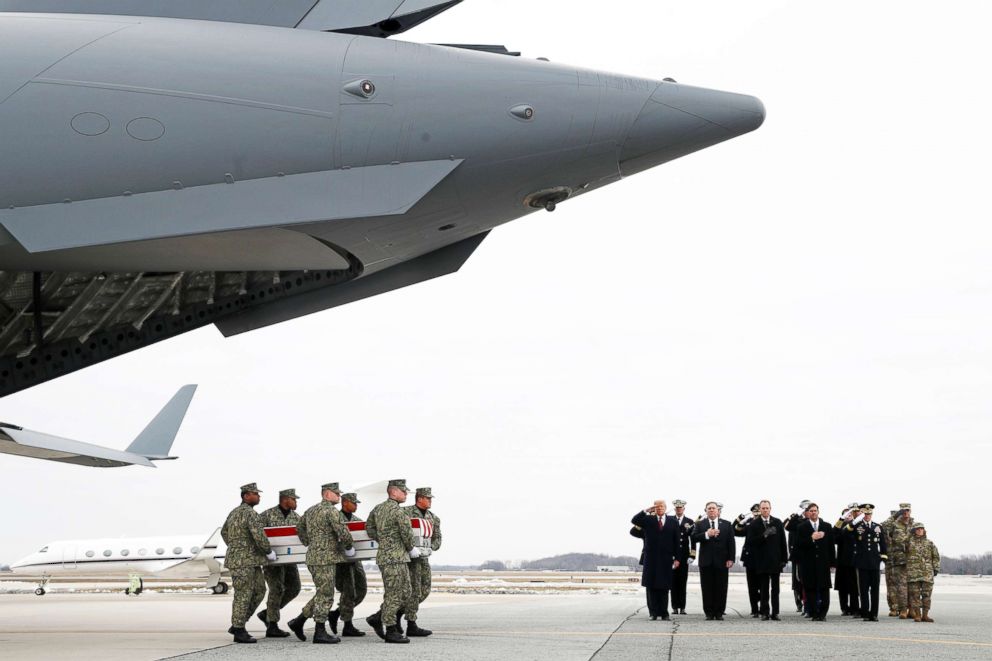 PHOTO: A U.S. Navy carry team moves a transfer case containing the remains of Scott A. Wirtz past President Donald Trump and the official party on Jan. 19, 2019, at Dover Air Force Base, Delaware.