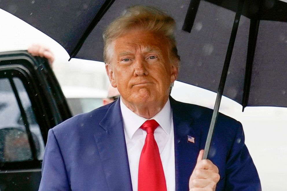 PHOTO: Donald Trump walks to speak with reporters before boarding his plane at Ronald Reagan Washington National Airport, Aug. 3, 2023, in Arlington, Va.