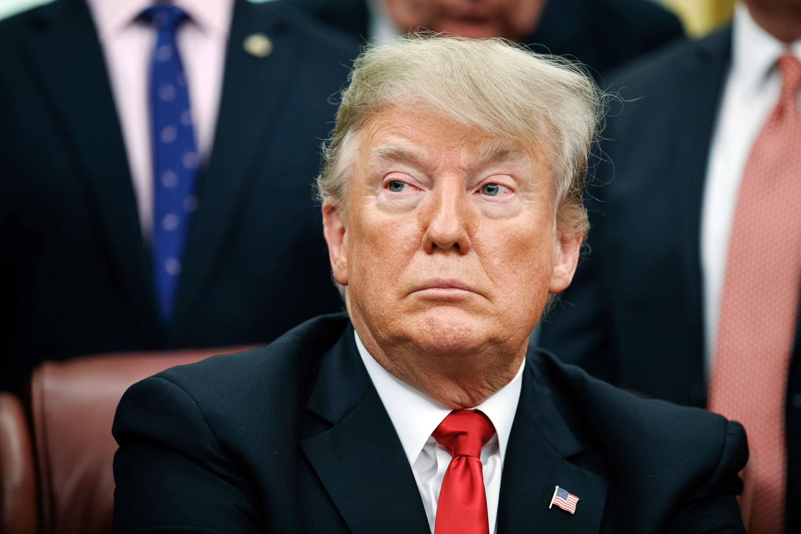 PHOTO: President Donald Trump listens during a signing ceremony for criminal justice reform legislation in the Oval Office of the White House in Washington D.C., Dec. 21, 2018. 