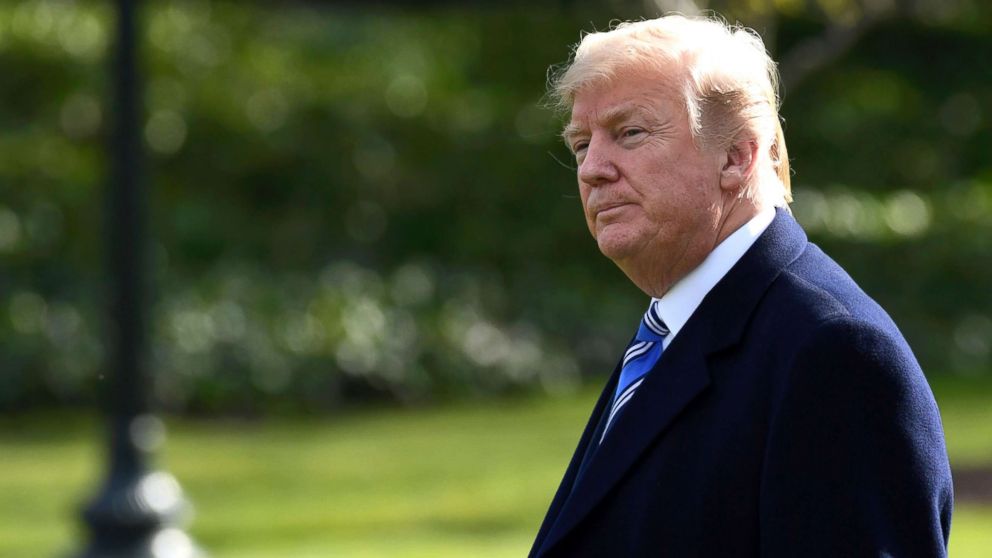 President Donald Trump walks across the South Lawn of the White House in Washington, D.C., March 23, 2018, as he heads to Marine One for a short trip to Andrews Air Force Base.