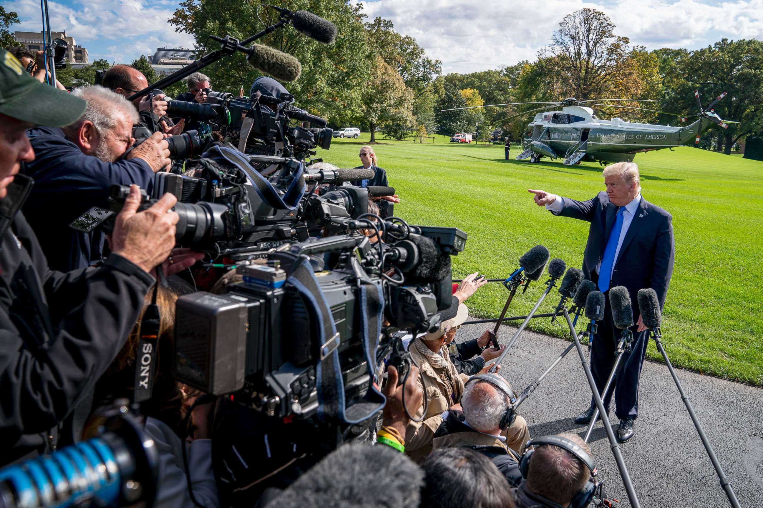 PHOTO: President Donald Trump calls on a reporter before boarding Marine One on the South Lawn of the White House in Washington, Oct. 25, 2017, for a short trip to Andrews Air Force Base, Md. and then on to Dallas.