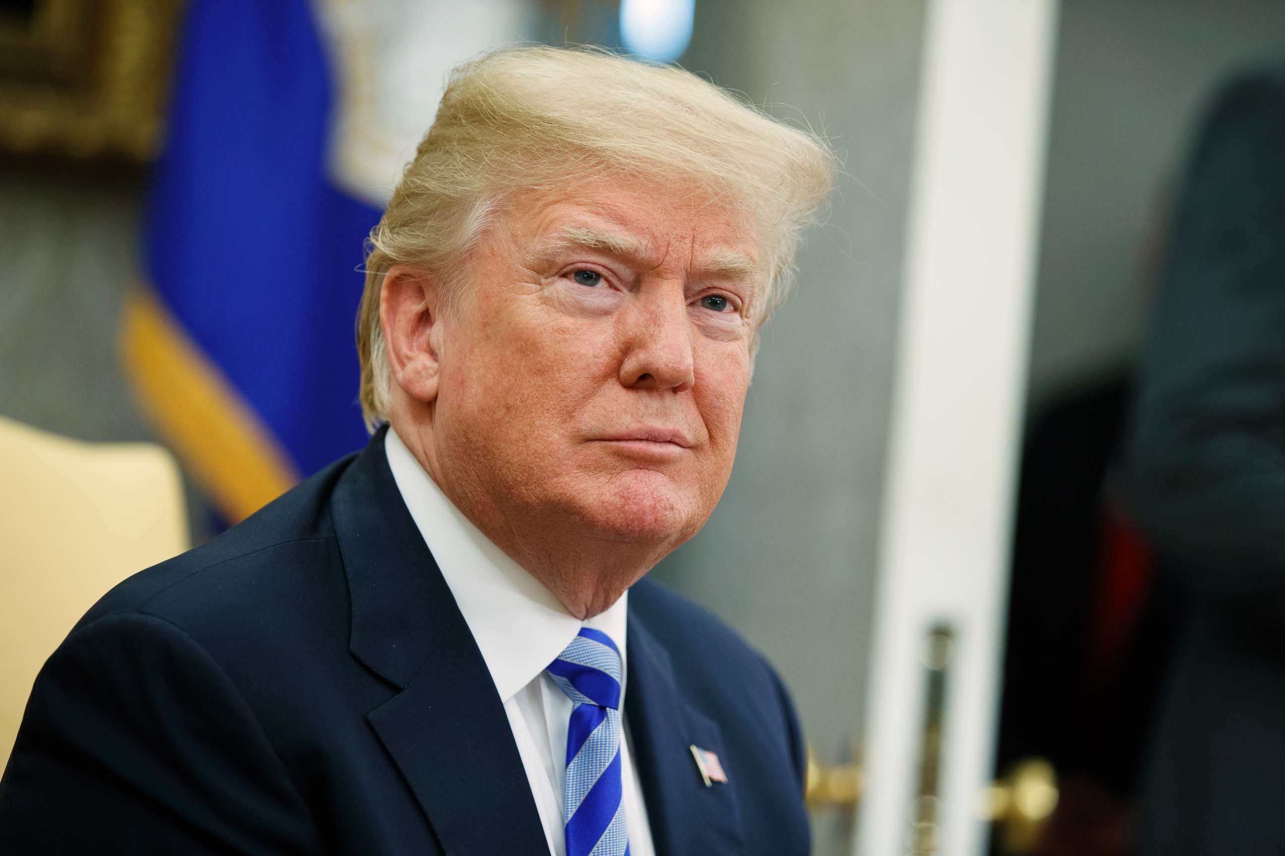 PHOTO: President Donald Trump listens to a question during a meeting in the Oval Office of the White House in Washington, May 16, 2018.