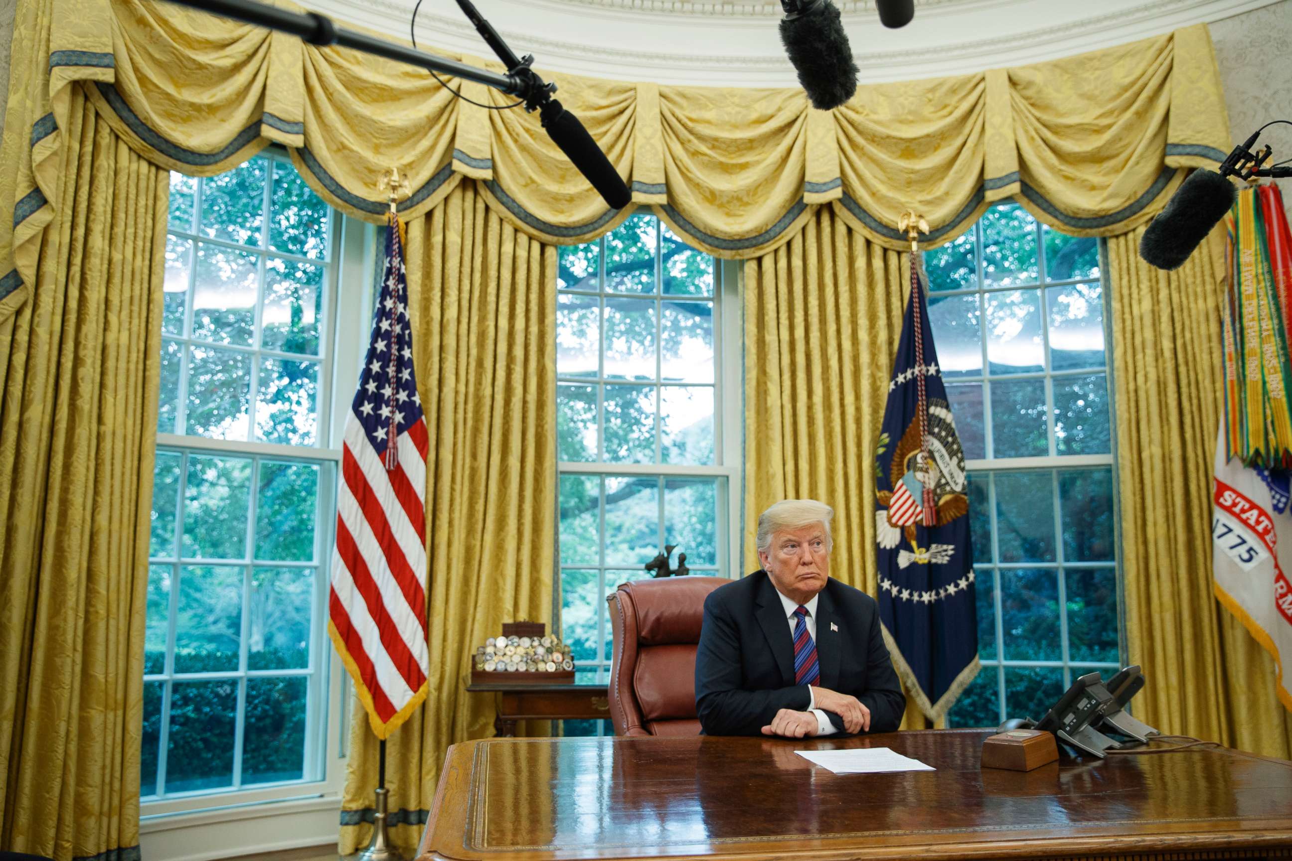 PHOTO: President Donald Trump listens during a phone call with Mexican President Enrique Pena Nieto about a trade agreement between the US and Mexico, in the Oval Office of the White House, Aug. 27, 2018.