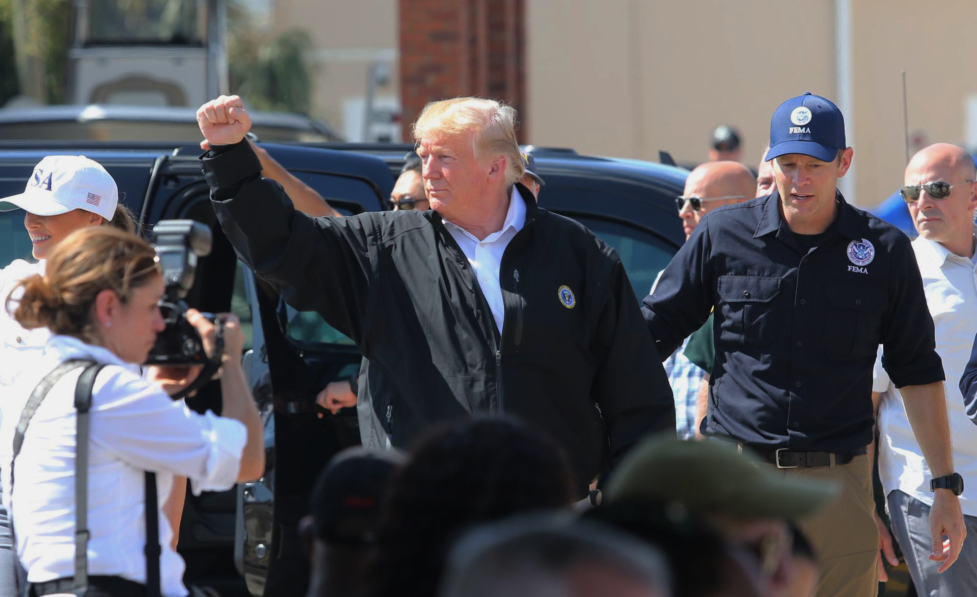 PHOTO: President Donald Trump raises his fist to chants of "USA" during a visit Monday, Oct. 15, 2018, to Lynn Haven, Fla., to see storm damage and recovery efforts following Hurricane Michael.