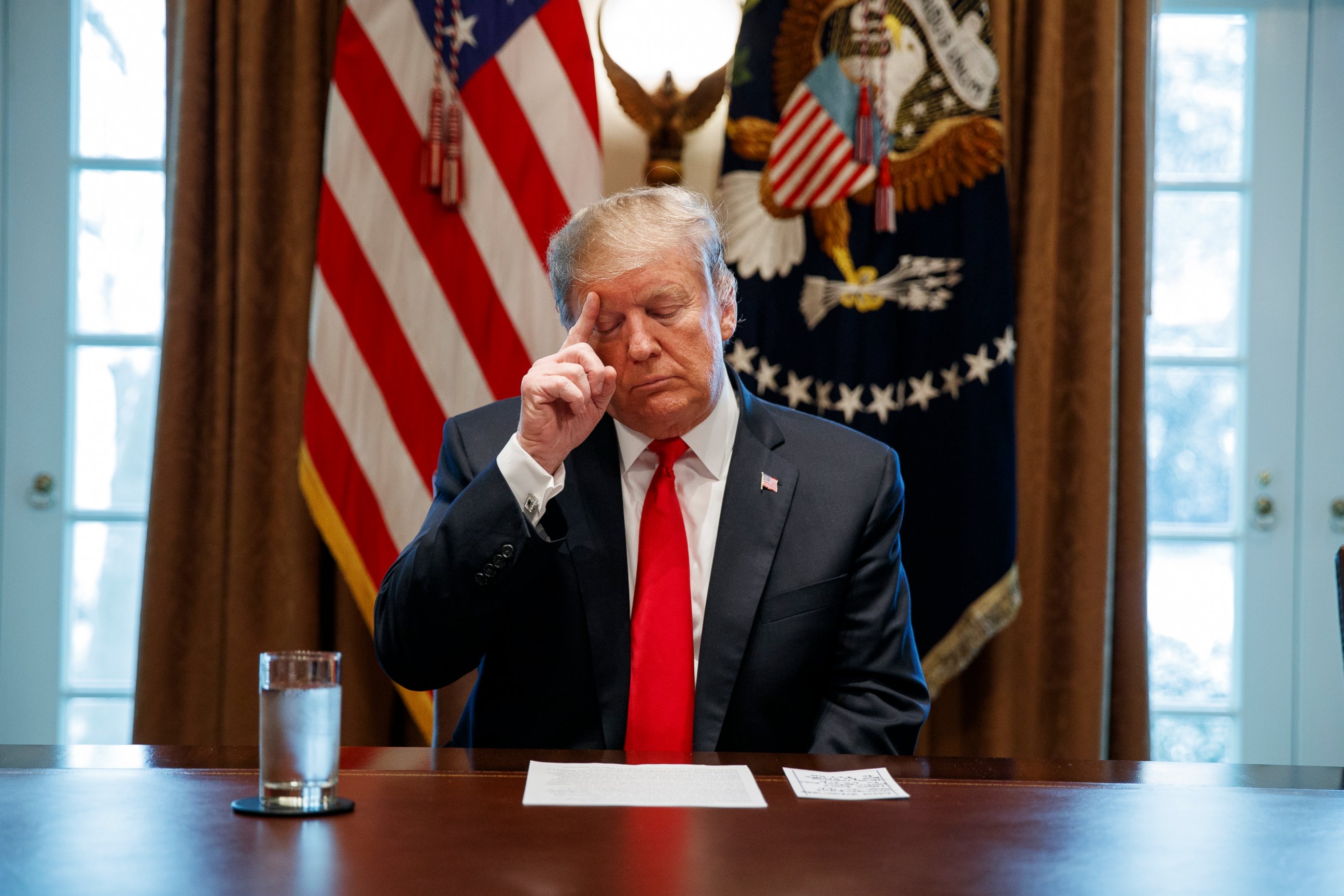 PHOTO: President Donald Trump looks at his notes before speaking during an event on human trafficking in the Cabinet Room of the White House, Friday, Feb. 1, 2019, in Washington.