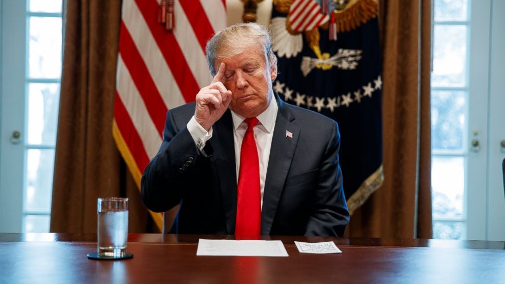 PHOTO: President Donald Trump looks at his notes before speaking during an event on human trafficking in the Cabinet Room of the White House, Friday, Feb. 1, 2019, in Washington.