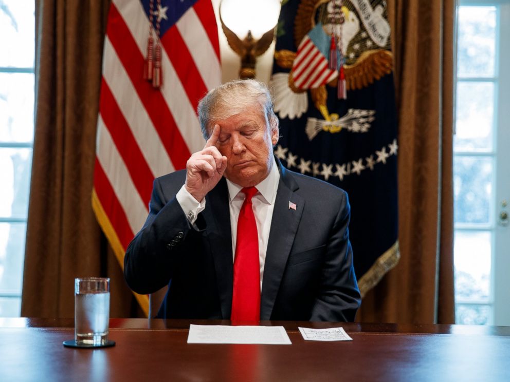 PHOTO: President Donald Trump looks at his notes before speaking during an event on human trafficking in the Cabinet Room of the White House, Friday, Feb. 1, 2019, in Washington.